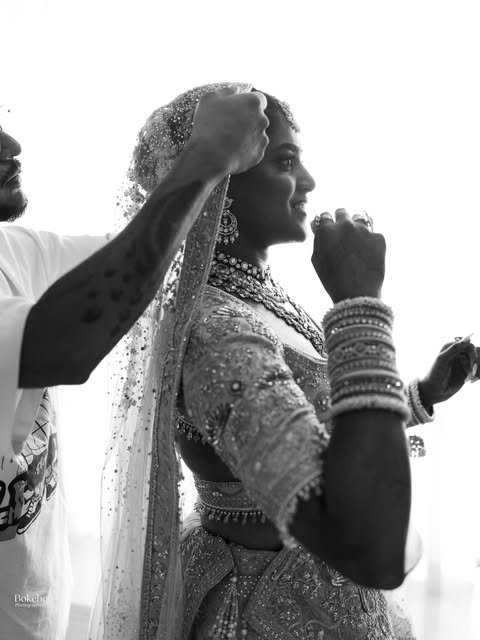 A bride getting ready in an intimate black-and-white portrait